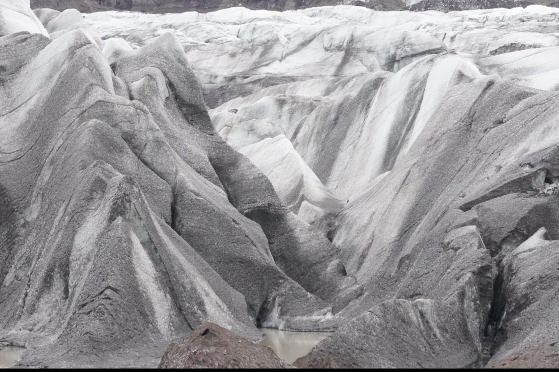 Glacier ice, layered and textured, Iceland.